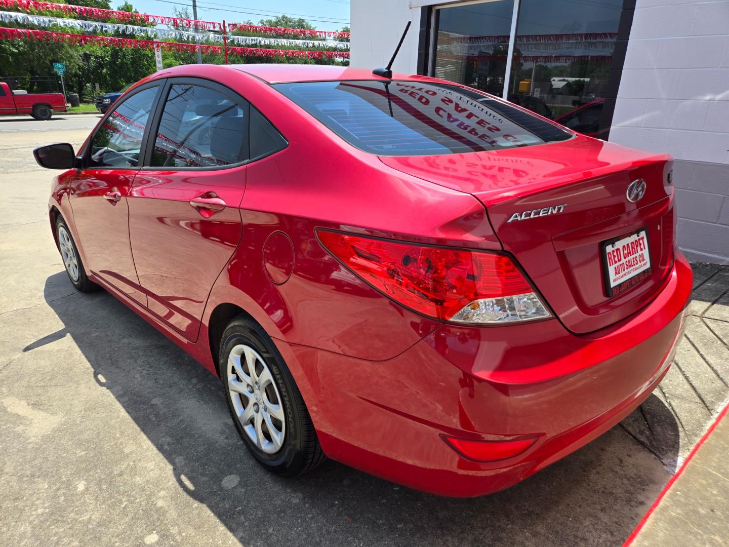 2014 Red Hyundai Accent GLS 4-Door (KMHCT4AE9EU) with an 1.6L L4 DOHC 16V engine, Automatic transmission, located at 503 West Court, Seguin, TX, 78155, (830) 379-3373, 29.568621, -97.969803 - Photo#3